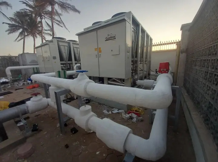 Insulated chilled water piping running to rooftop chillers