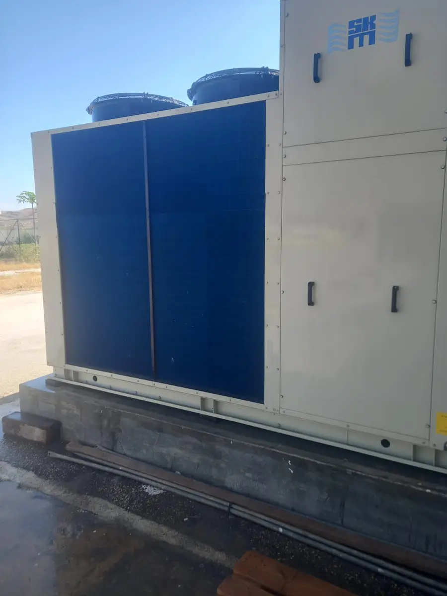 Packaged air conditioning unit installed on a concrete base
